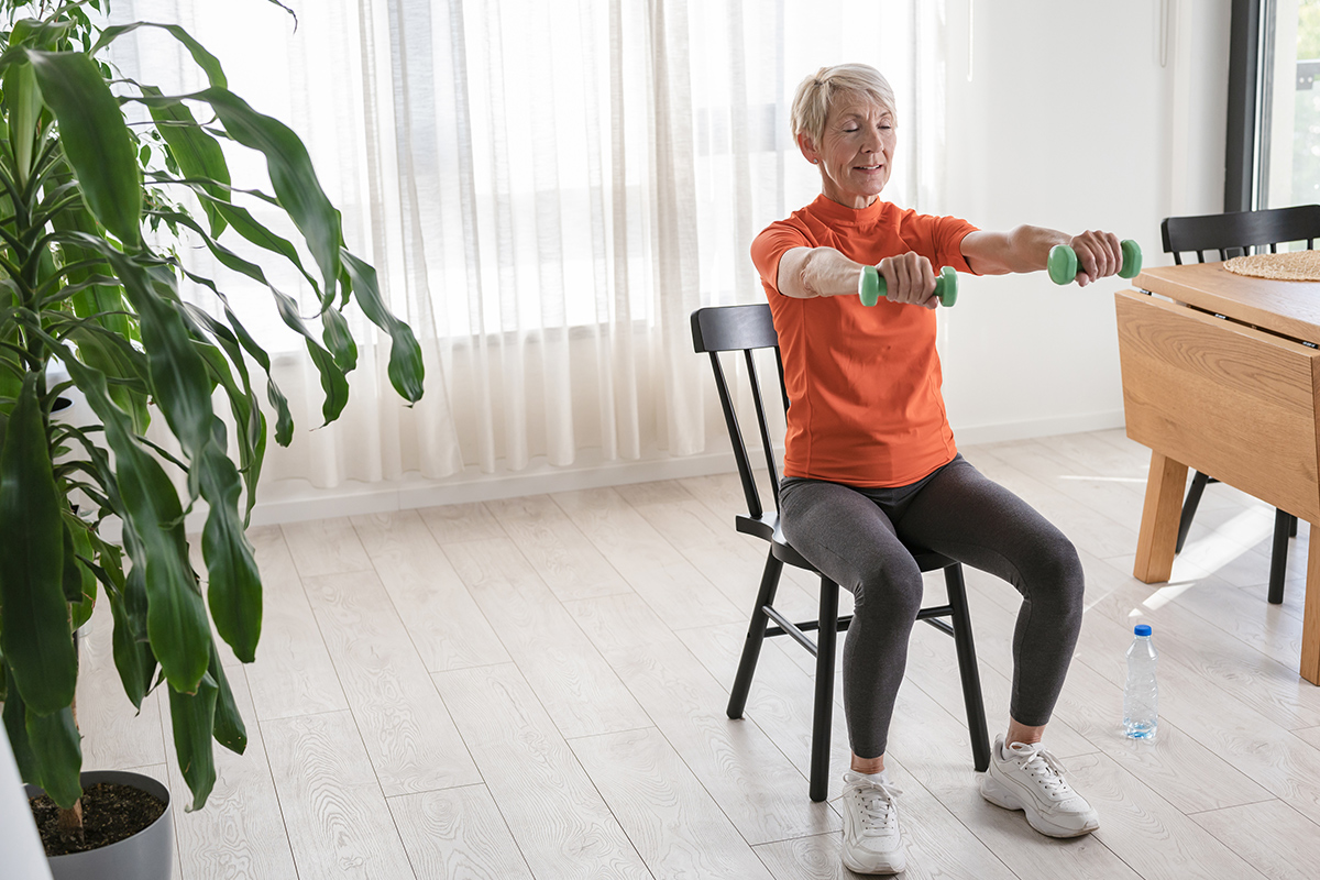 Senior woman doing chair exercises