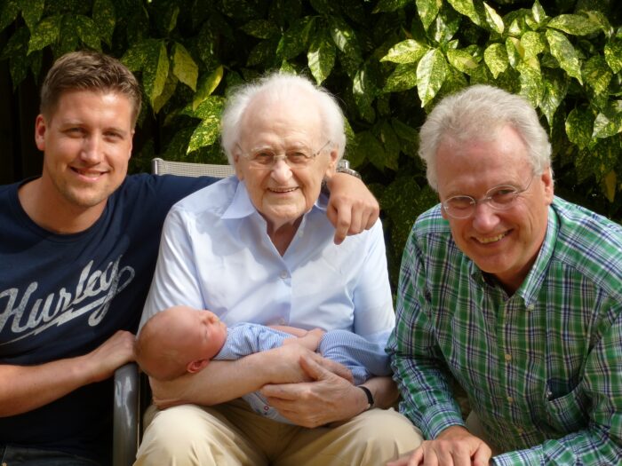 grandparents holding their grandchild