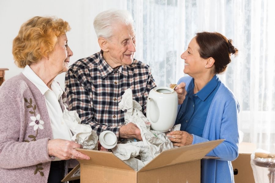 Daughter helping parents move into senior living