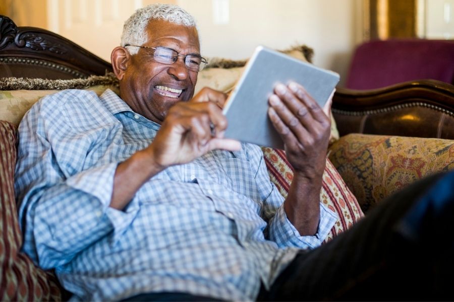 Senior man using iPad