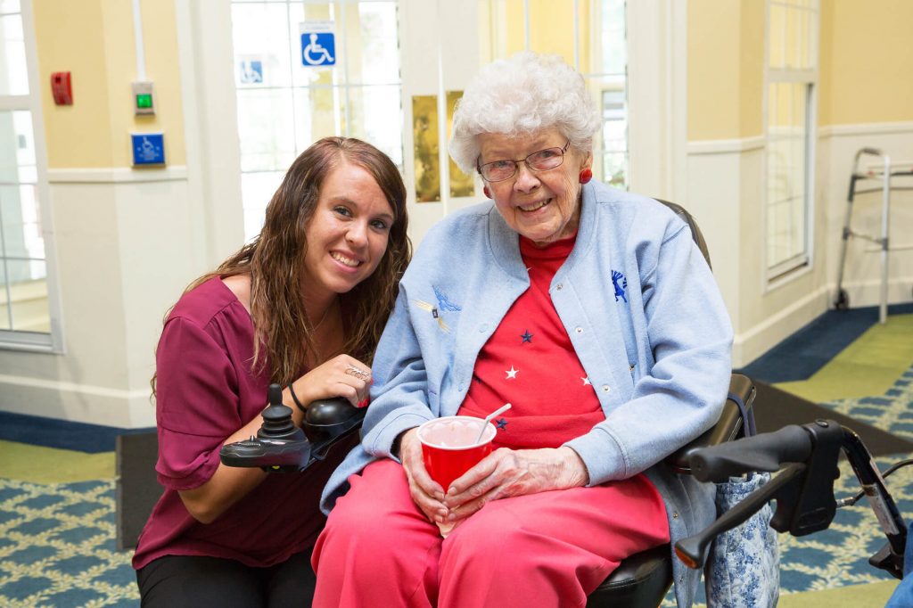 assisted living resident with caregiver