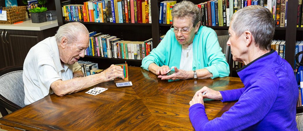 residents playing cards together