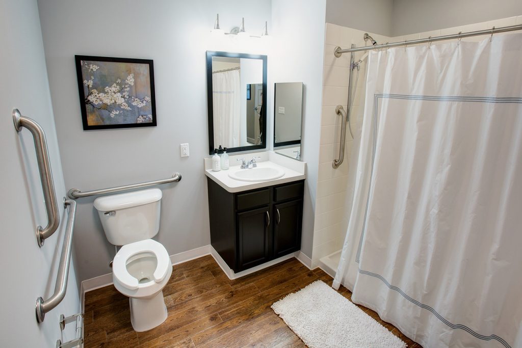 senior living bathroom with grab bars