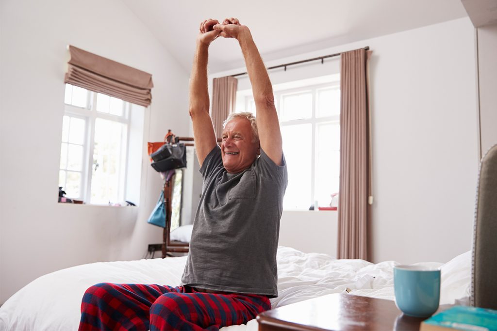 Older man doing morning stretches