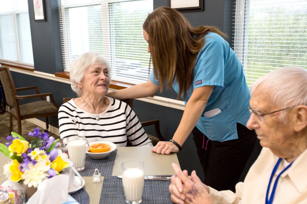 Staff member with senior living residents