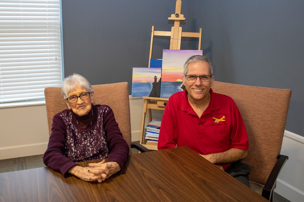 Mother and son spending time together within the StoryPoint Senior Living Community in order to help make the transition to senior living more comfortable