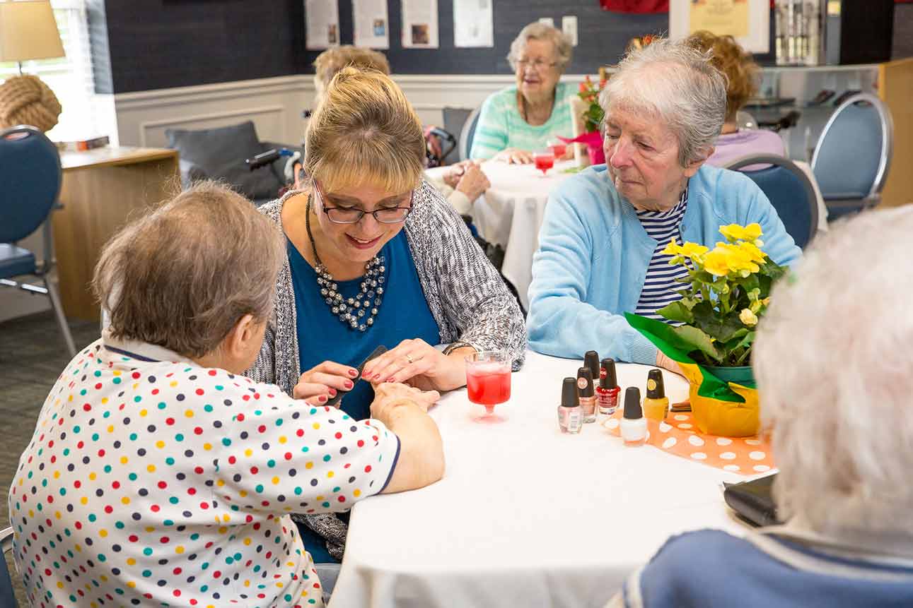 seniors playing games in common area at senior living community