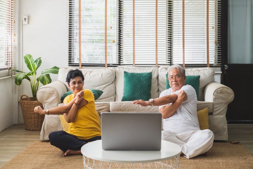 Senior couple doing online exercise video