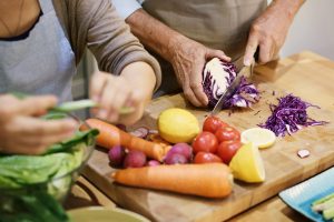 Older Adults Cutting Vegetables 