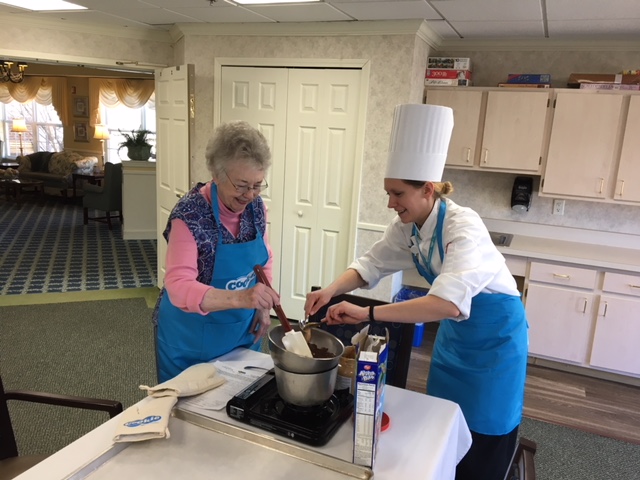 pastry chef helping a StoryPoint resident 