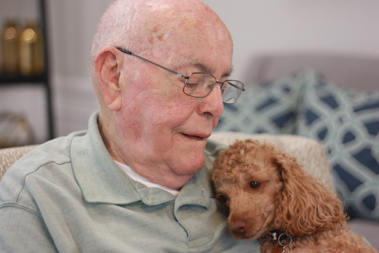 StoryPoint Resident and his dog