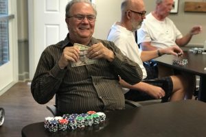 senior living residents playing poker