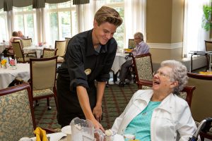 senior being served ice cream