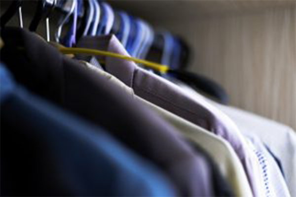 image of clothes hanging in a closet