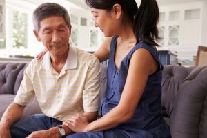 Adult Daughter Talking to her Father about senior living