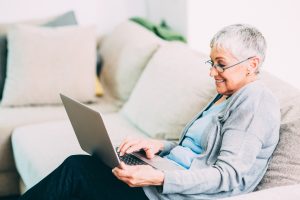 Senior woman using new technology