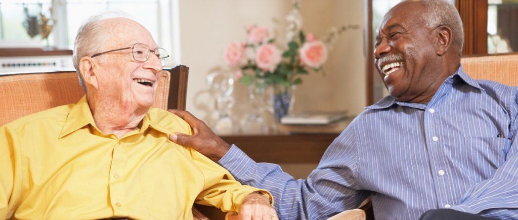 Two senior men laughing together