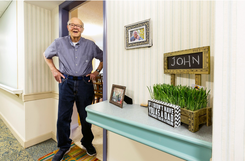 senior living resident outside his apartment