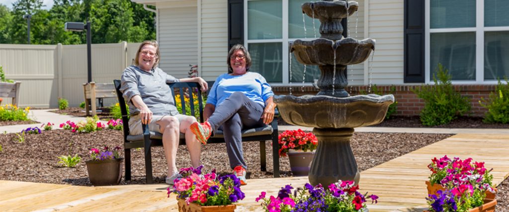 senior living residents relaxing outside