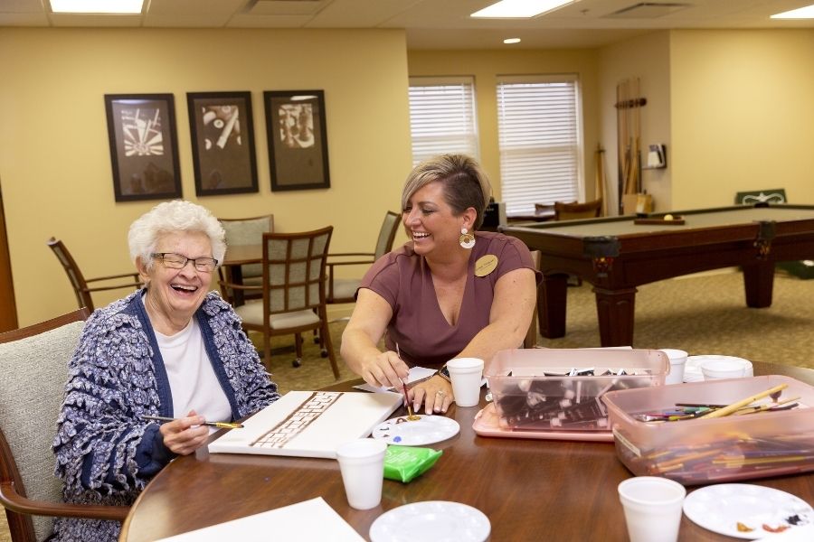 StoryPoint caregiver painting with resident