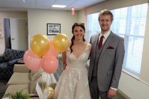 bride and groom with balloons