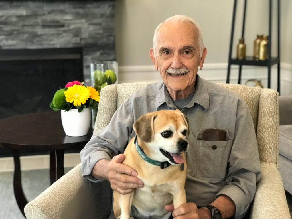 A senior man with his dog