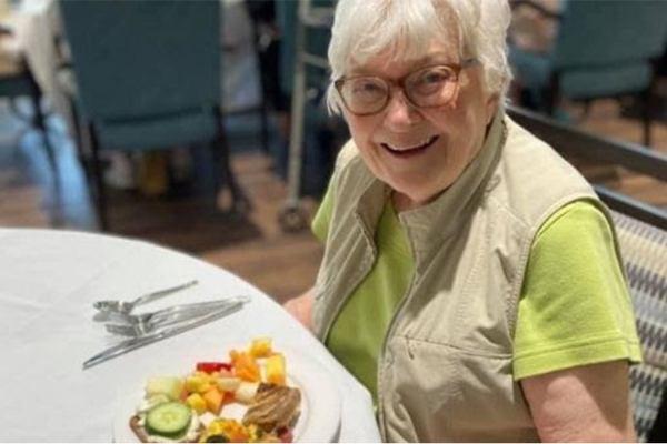 storypoint resident senior smiling eating