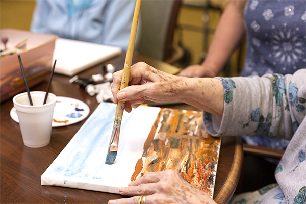 senior resident painting