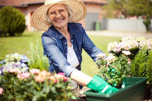 senior woman gardening resident