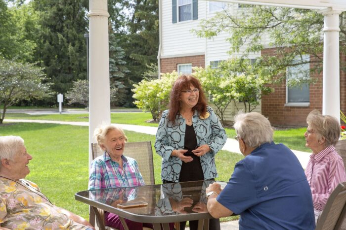 leisure living employee talking to residents