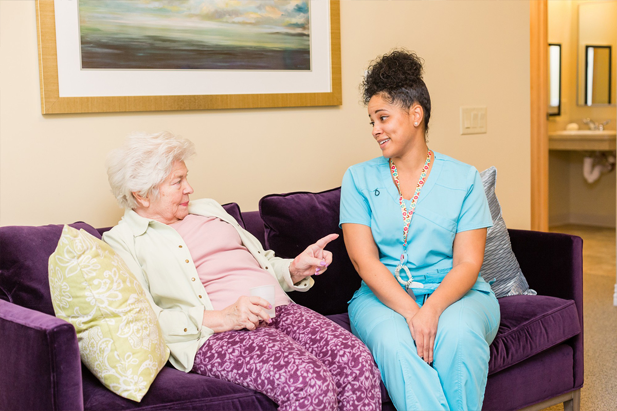 StoryPoint resident having a conversation with a caregiver