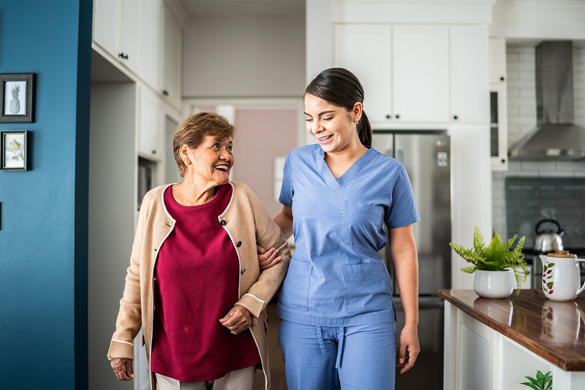 Senior walking with a caregiver