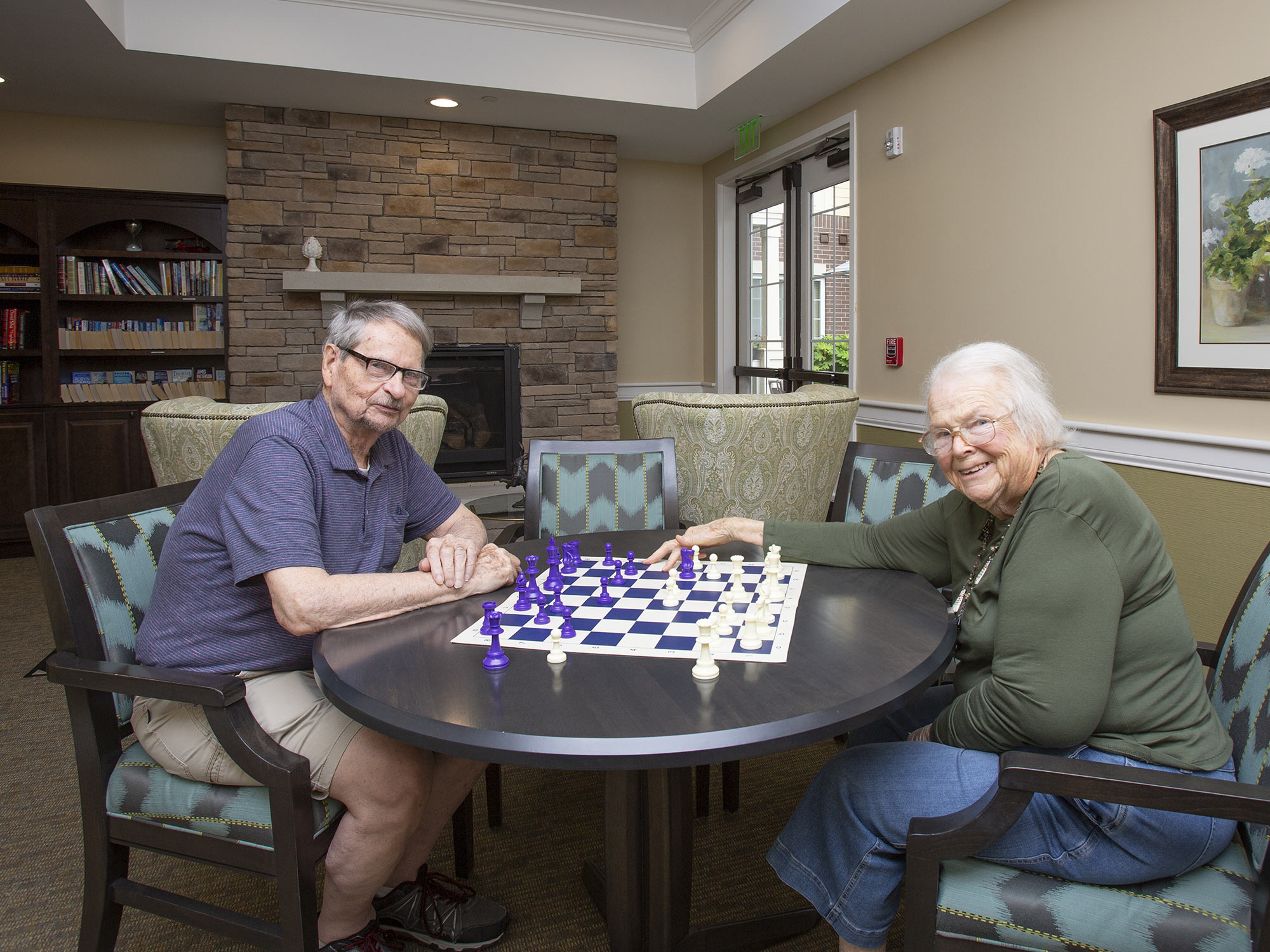 Senior living residents playing chess