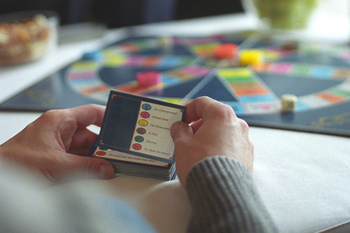 senior playing a card game