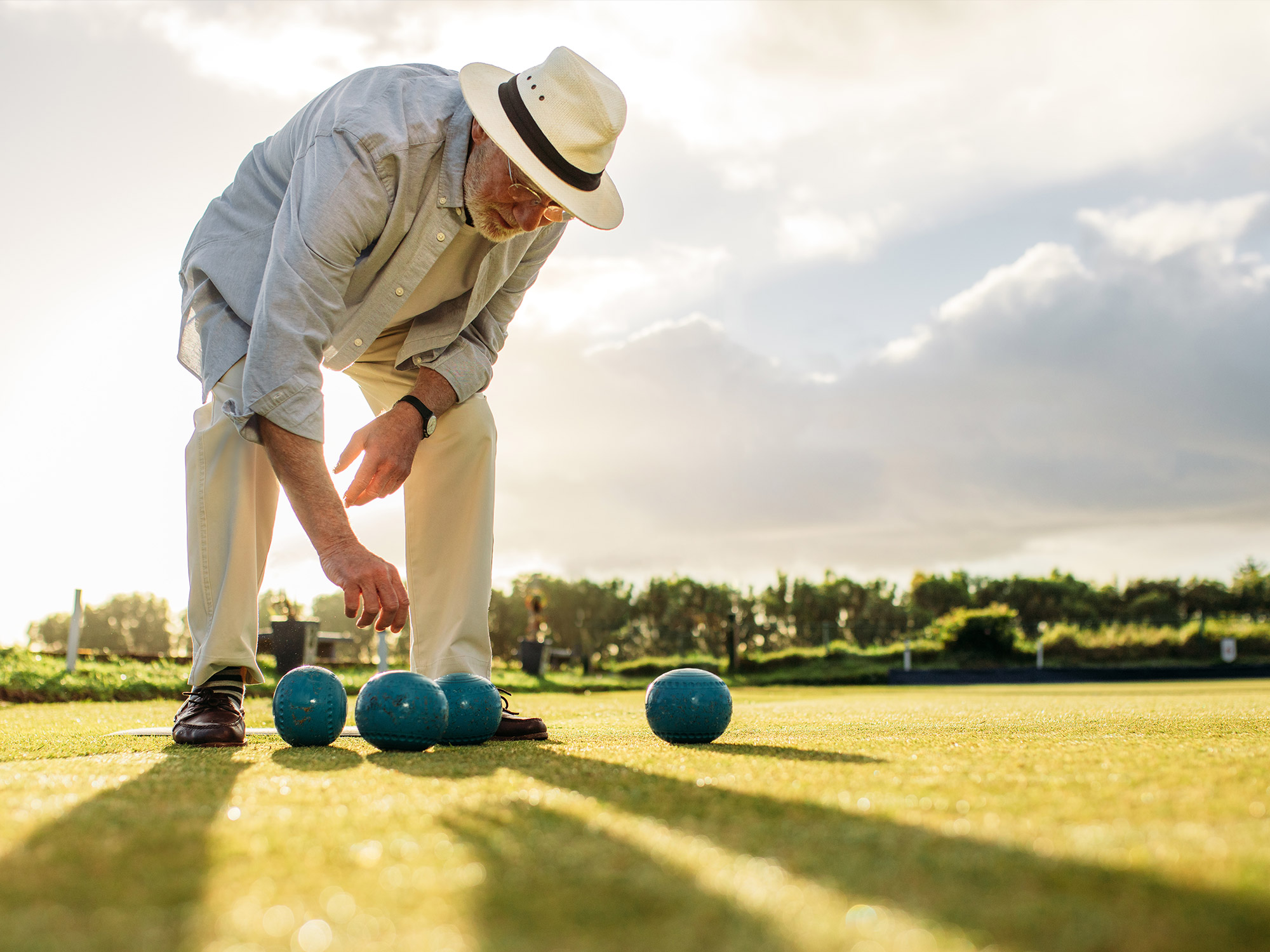 senior playing bocce ball