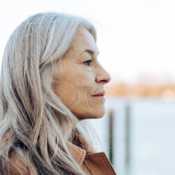 Senior woman standing outside