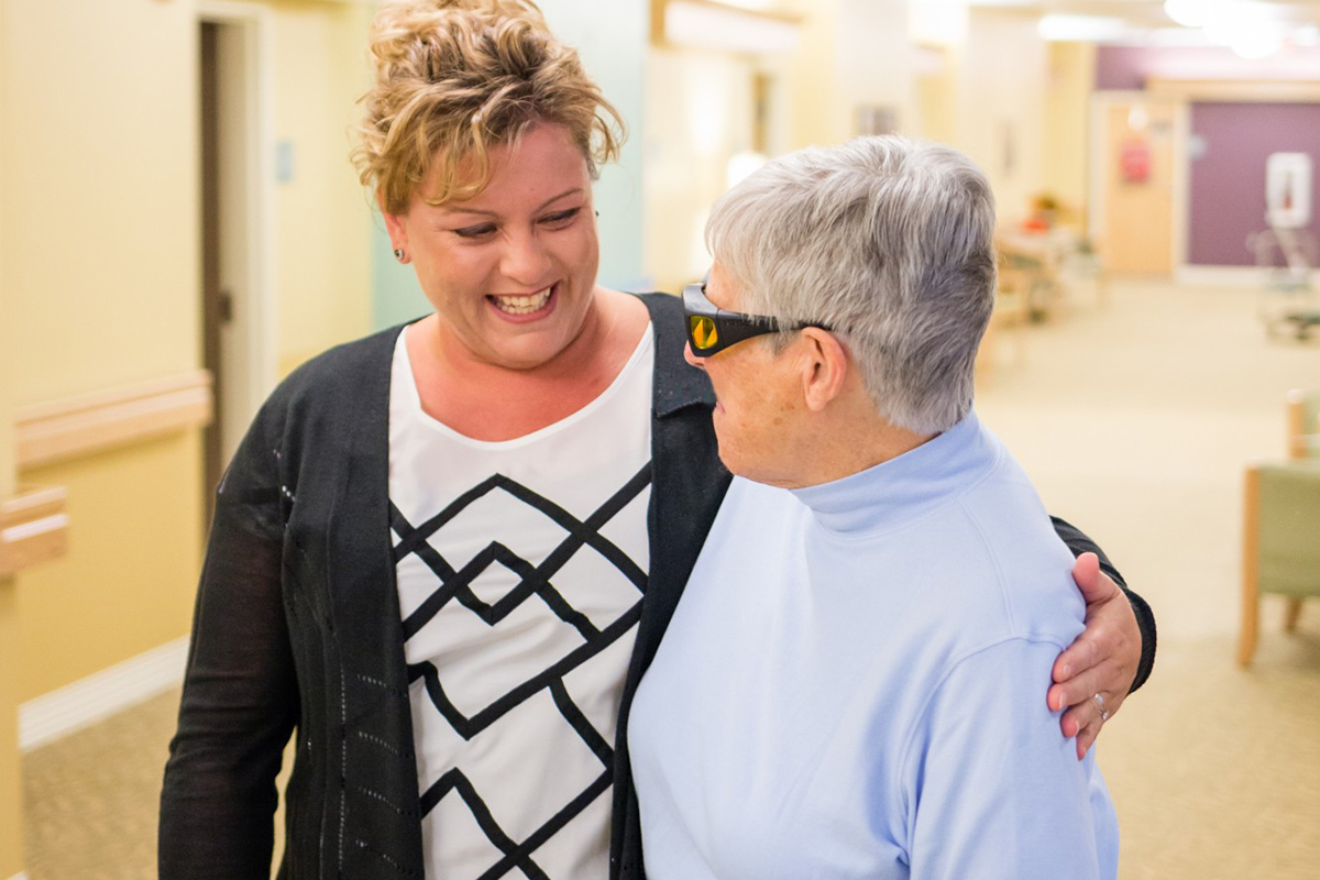 StoryPoint Group caregiver with a resident 