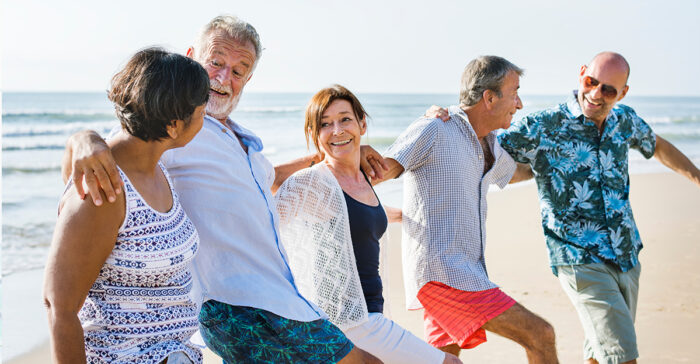 seniors walking on the beach