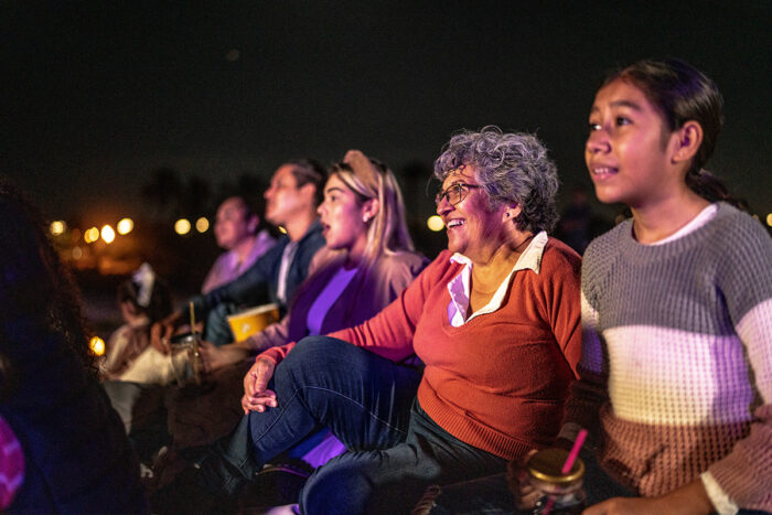 family watching a movie at the theater