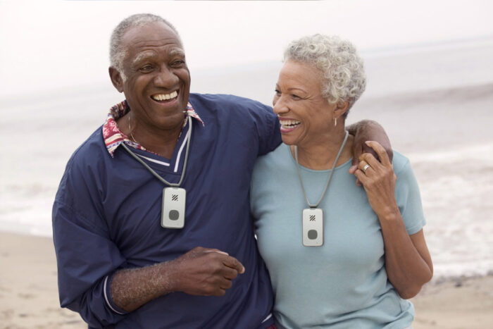 senior couple wearing the LifeStation Mobile With GPS fall detection device