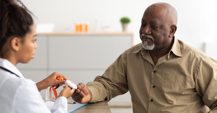 Senior talking to a doctor about a fall detection device