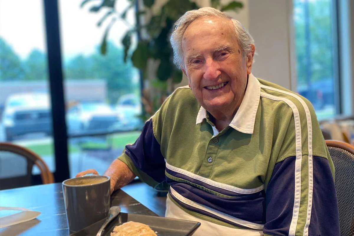 StoryPoint Group Resident having a coffee and a pastry 