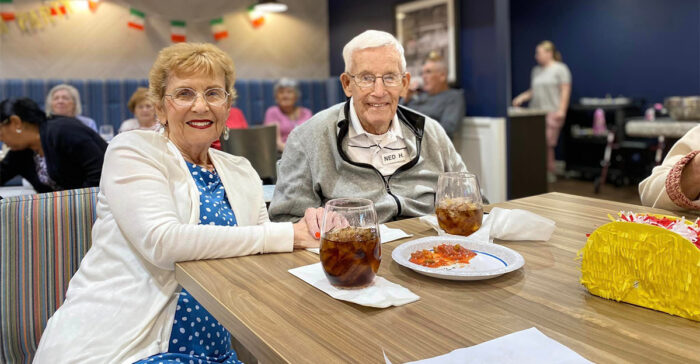 Two StoryPoint Group residents in the community dining room