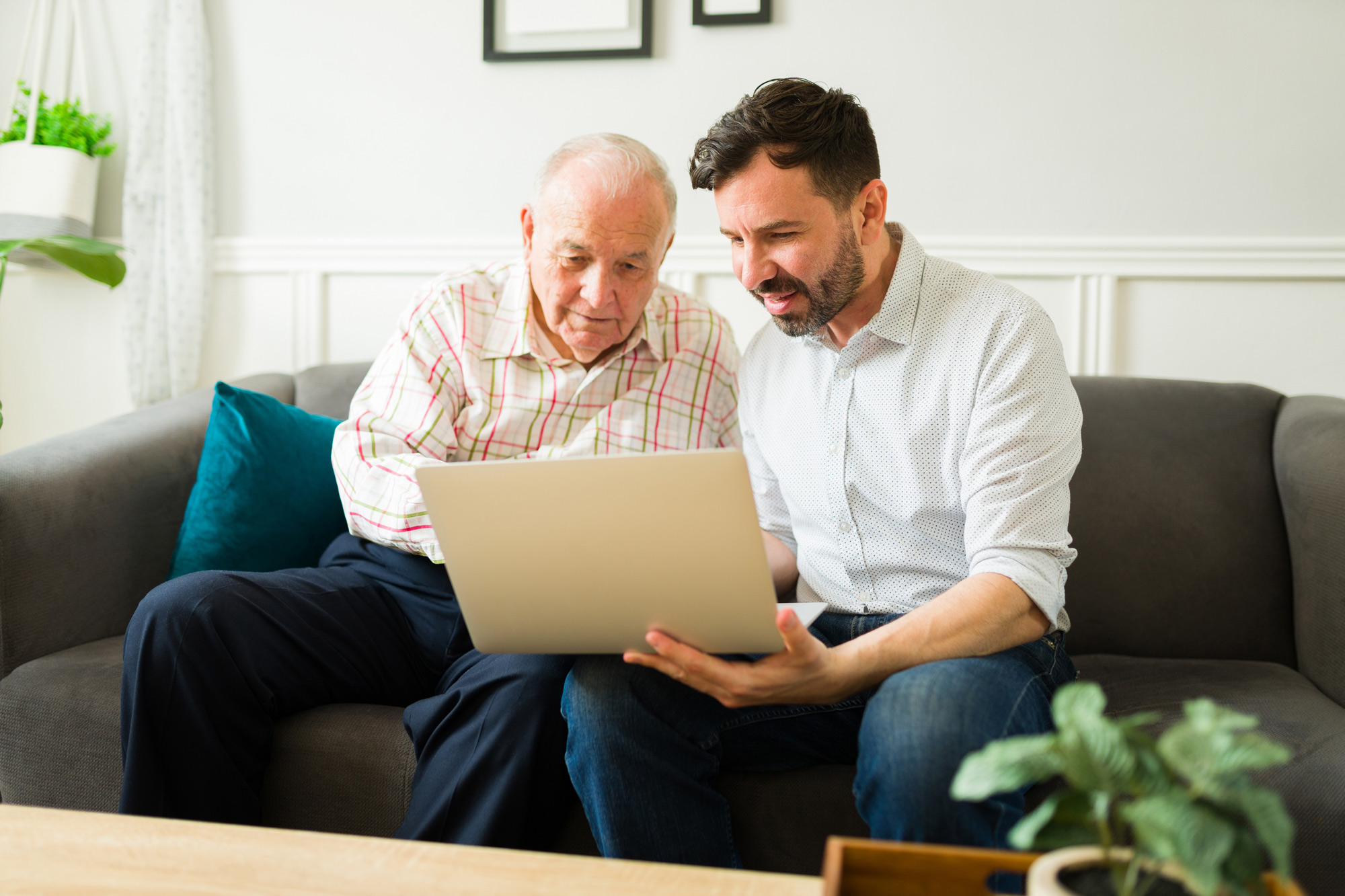 Father and son using the computer