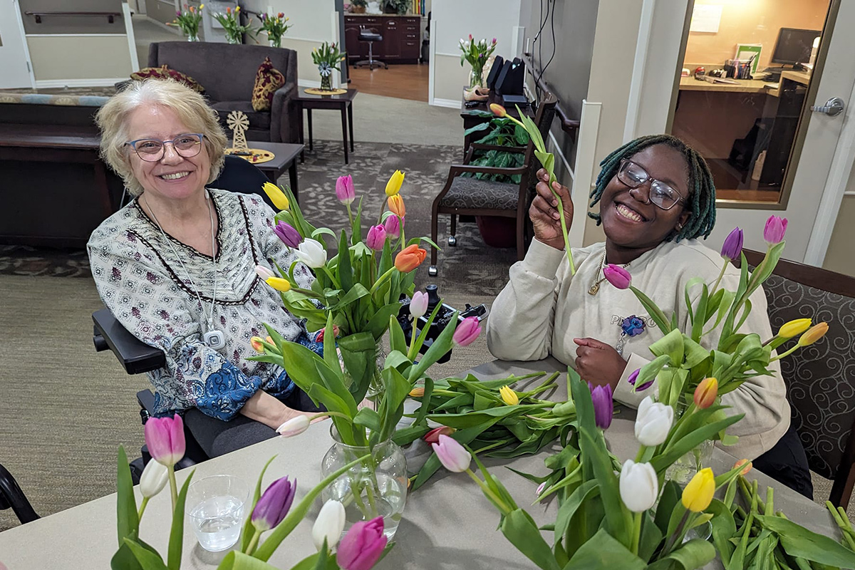 seniors with dementia making bouquet of flowers 