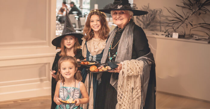 StoryPoint Resident and grandchildren in matching halloween costumes