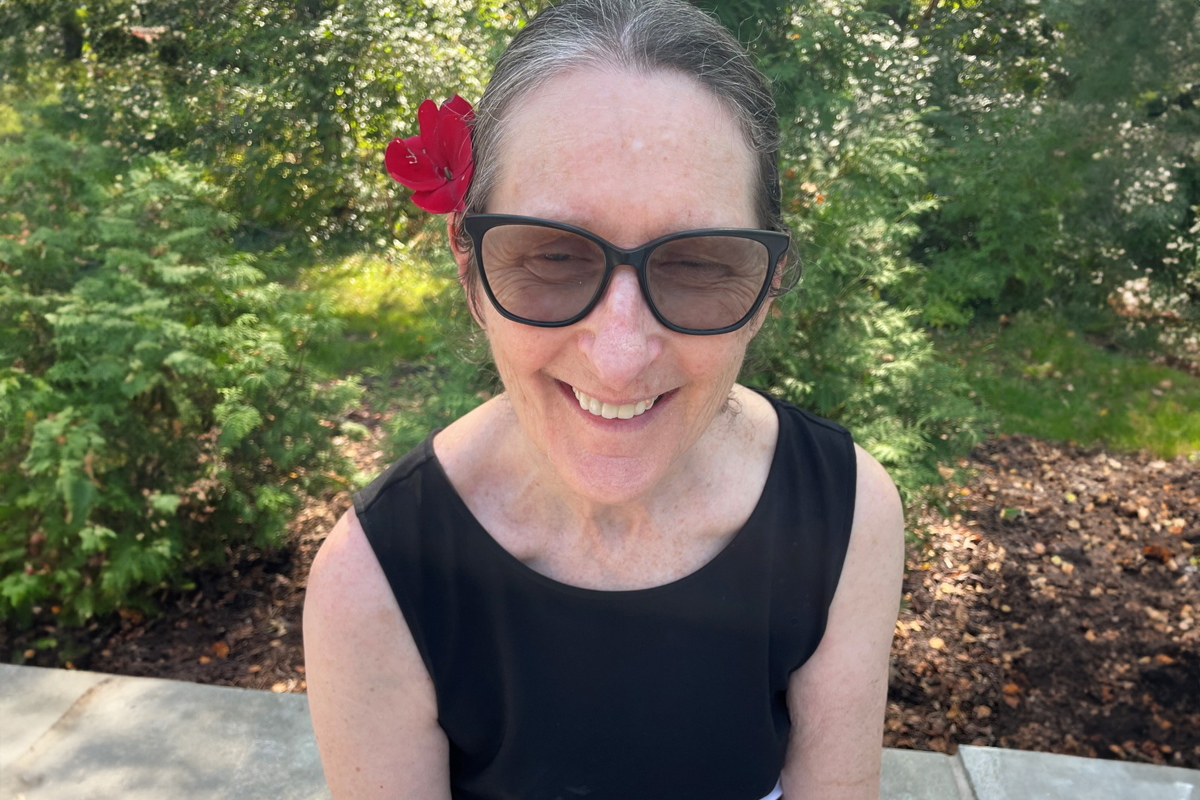 Leisure Living Grandhaven resident with flower in hair