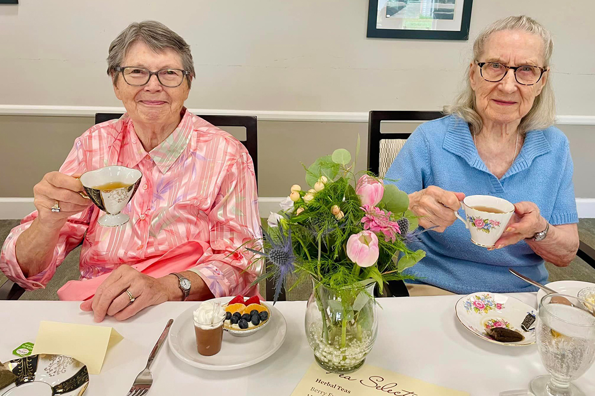 Seniors with dementia having a tea party