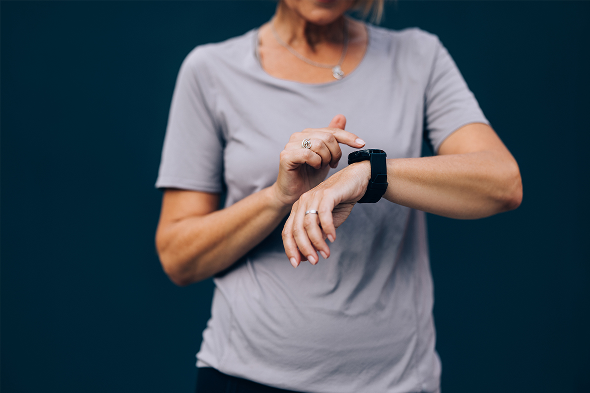 senior woman using a fitness tracking device