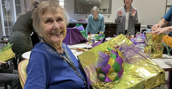 StoryPoint Group resident holding a gift